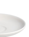White ceramic plate by Alessi with a wide, smooth rim, shown in a cropped view.