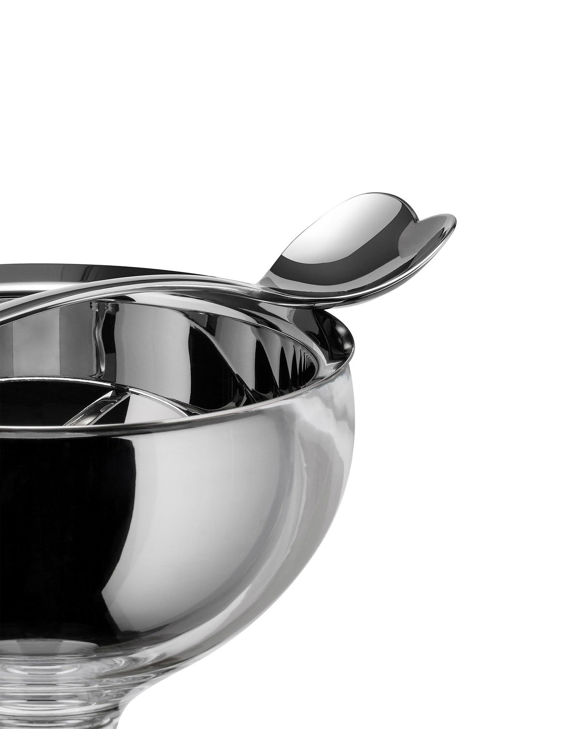 Silver reflective ice cream bowl by Alessi with heart-shaped spoons, cropped close-up.