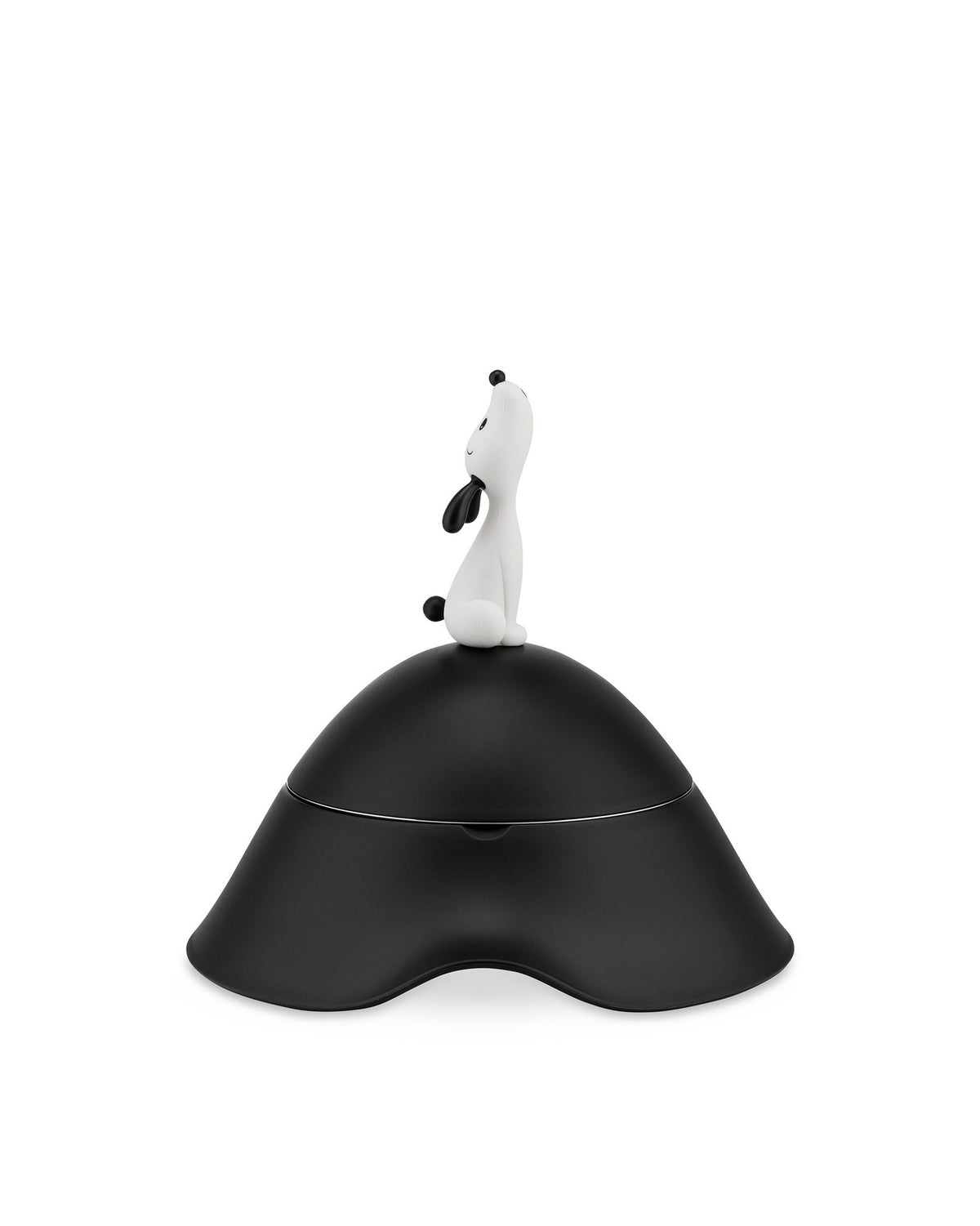 Black lidded jar by Alessi with a white dog figurine on top and an undulating base.