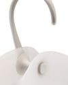 Light grey cooler by Alessi with a curved handle, clear tip, and matte texture.