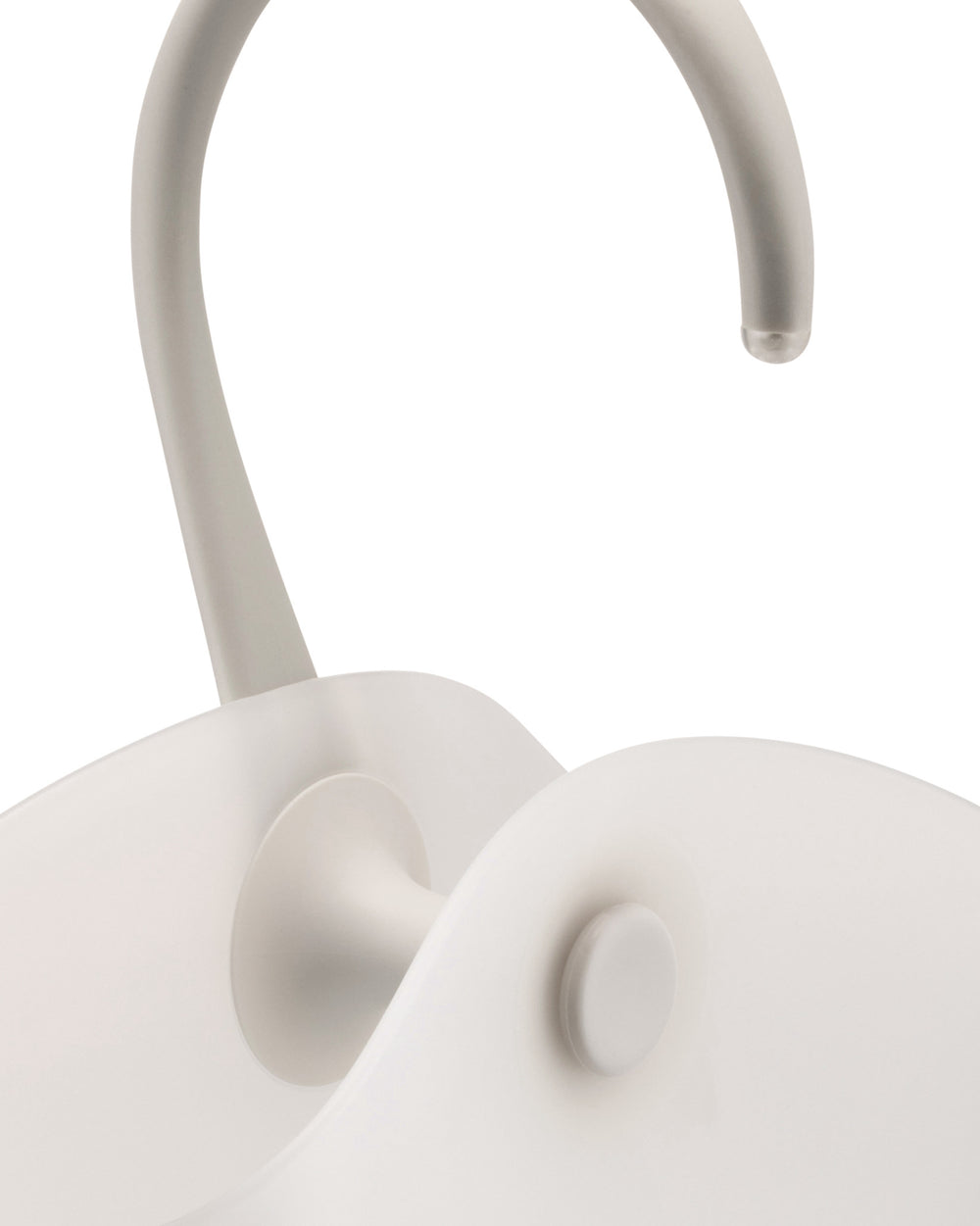 Light grey cooler by Alessi with a curved handle, clear tip, and matte texture.