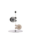 Modern salt and pepper set by Alessi, with black, frosted white, and beige spherical shakers suspended from a silver base.