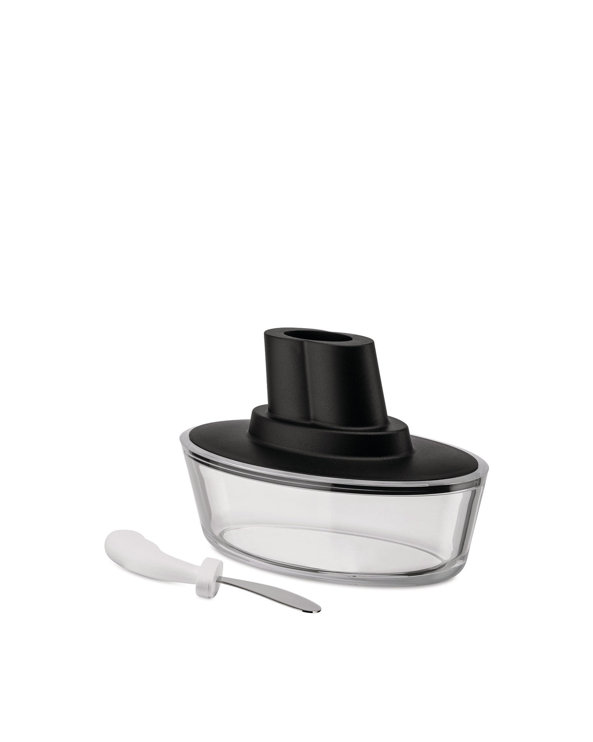 Clear glass and black Ship-shaped butter dish by Alessi, shown with a white-handled spreader.