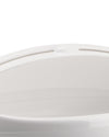 White container by Alessi with a smooth, curved top edge and subtle raised handle detail, cropped view.