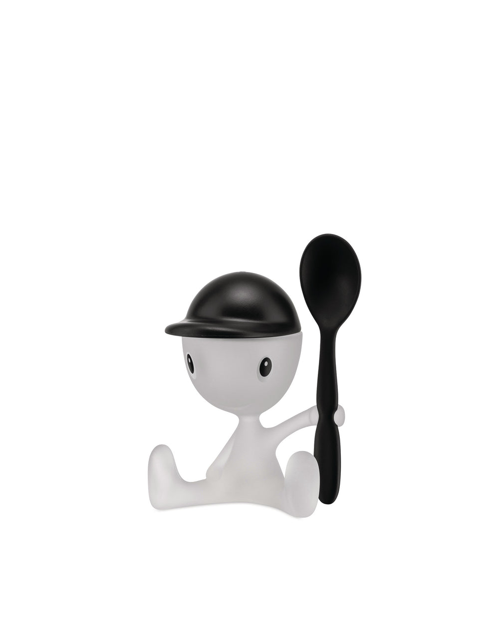 White and black plastic Cico egg cup by Alessi, styled as a sitting person wearing a black cap and holding a black spoon.