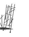 Black metal fruit bowl by Alessi, featuring an abstract arrangement of intersecting rods and small rounded feet, cropped.