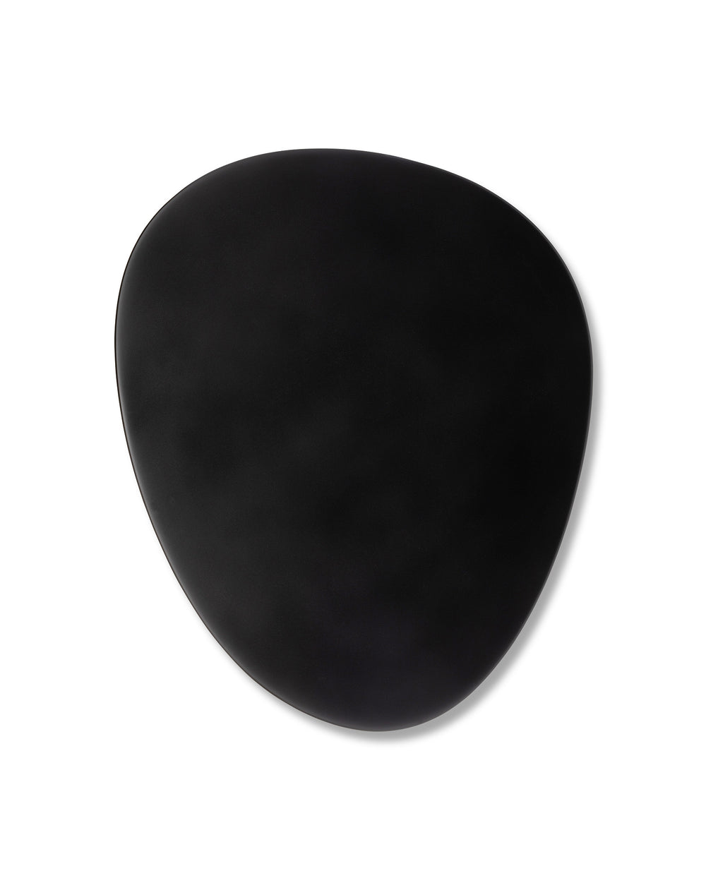 Matte black irregularly shaped dish by Alessi, featuring subtle curves and a soft shadow.