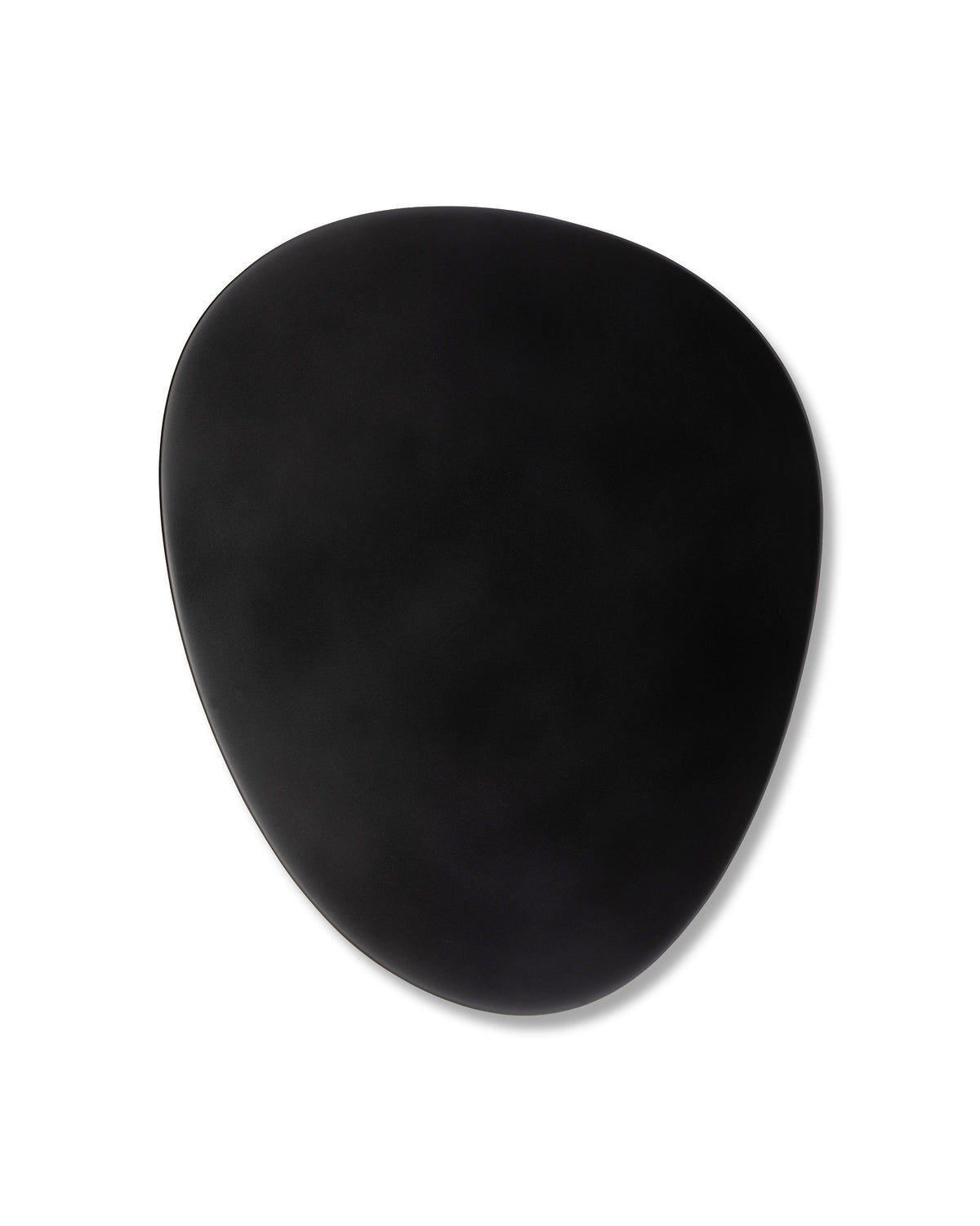 Matte black irregularly shaped dish by Alessi, featuring subtle curves and a soft shadow.