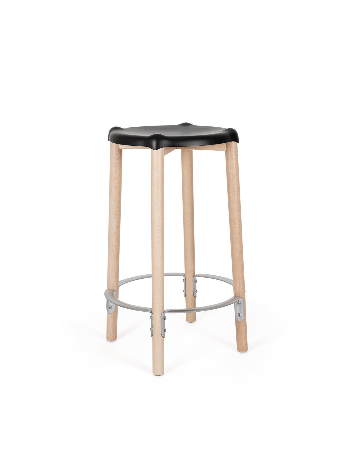 Black contoured stool by Alessi with light wood legs and a circular silver footrest, front view.