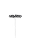 Silver metal milk frother whisk head by Alessi, with multiple concentric spring coils on a thin shaft, centered.