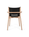 Black and light wood Poêle Collection chair by Alessi, with a curved wooden frame, armrests, and visible branding on the seat back.