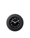 Black round wall clock by Alessi with white numbers and hands on a clean white background.