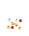 Metallic Christmas ornaments by Alessi featuring a gold shooting star and red, gold, and silver round pieces.