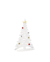 White decorative Christmas tree by Alessi with red, silver, and gold ball ornaments, and a golden star topper.