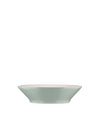 Light green ceramic bowl by Alessi with a wide rim and cream interior, shown from a side view.