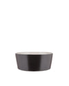 Dark gray bowl with a cream interior by Alessi, featuring a modern tapered design.