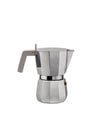 Silver aluminum moka pot by Alessi with a light grey handle and octagonal body.