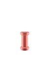 Pinkish-red wooden pepper mill by Alessi, with a cylindrical shape and visible wood grain.