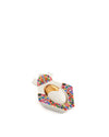 White and gold Jesus ornament by Alessi with a multicolor geometric pattern.
