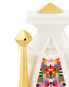 White geometric figurine with gold accents by Alessi, featuring a colorful pixelated pattern and a separate gold staff.
