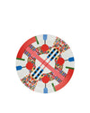 A round white plate by Alessi with a vibrant pixelated pattern, red rim, and abstract geometric designs.