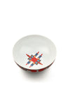 White bowl by Alessi with a pixelated, colorful star-like design inside and red dots on the outer rim.