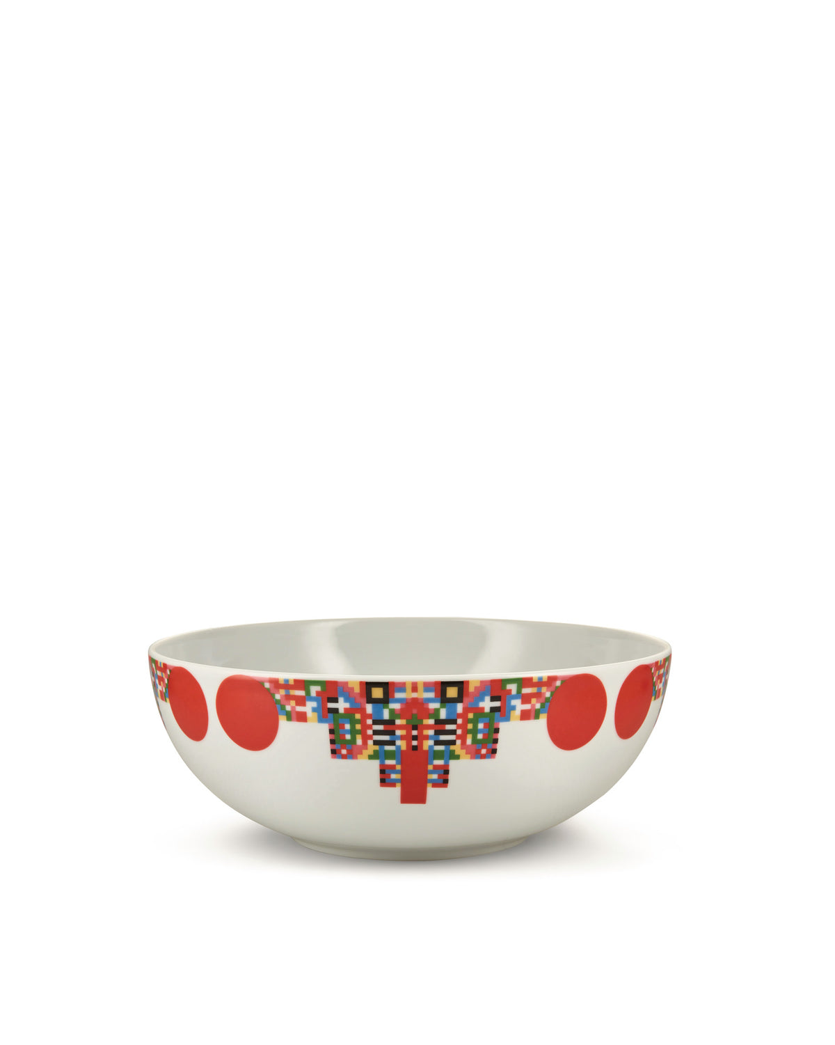 White bowl by Alessi with a multi-colored geometric pattern and large red polka dots.