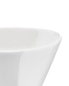 White serving bowl by Alessi, a close-up of its smooth, curved rim and inner surface.