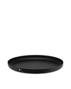 Round black tray by Alessi featuring a distinct dimpled texture across its surface and rim.