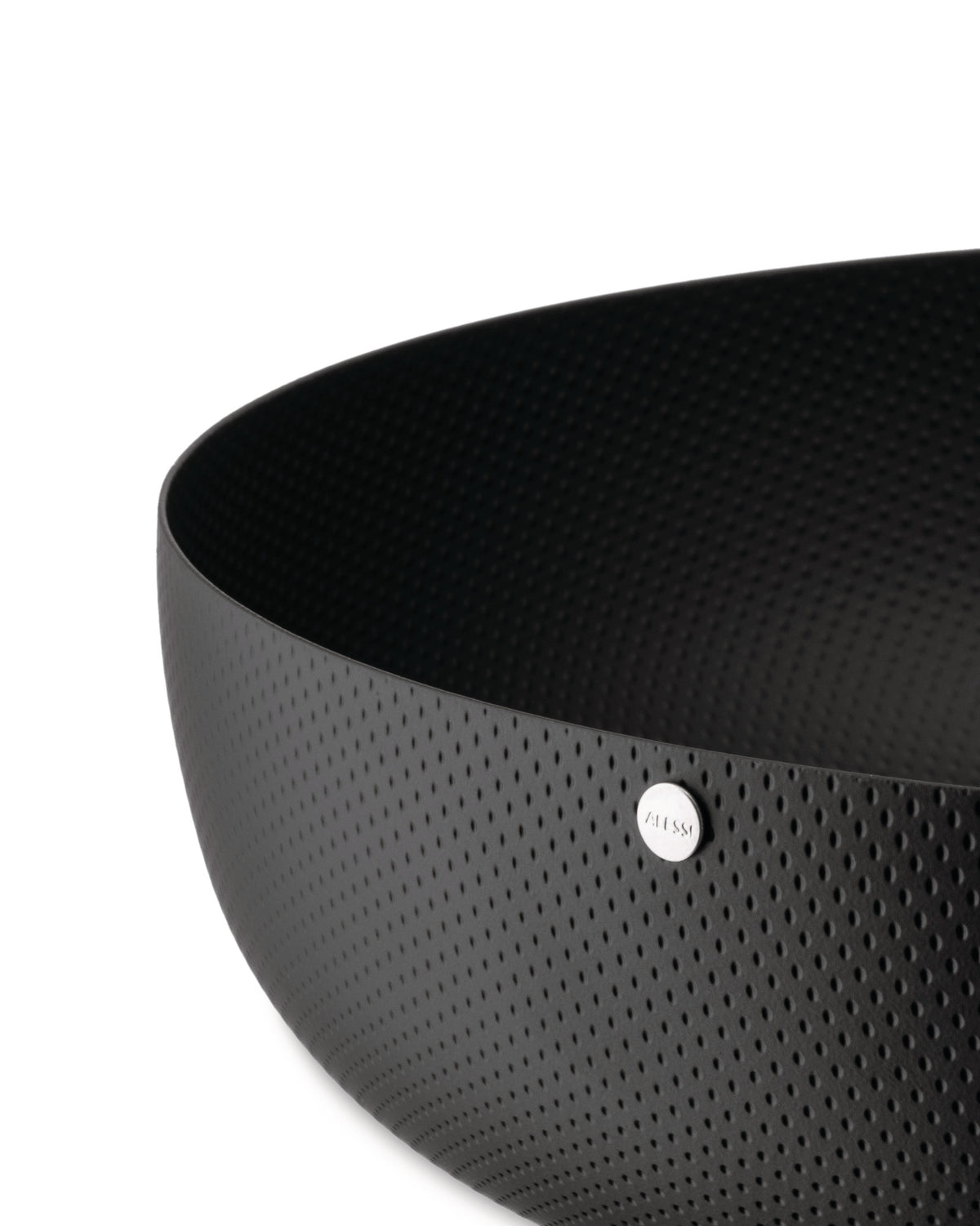Black perforated bowl by Alessi with a silver logo badge, shown in a close-up, cropped view.