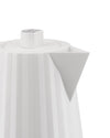 White electric kettle by Alessi with a fluted body, geometric spout, and gray logo on the lid's push-button.