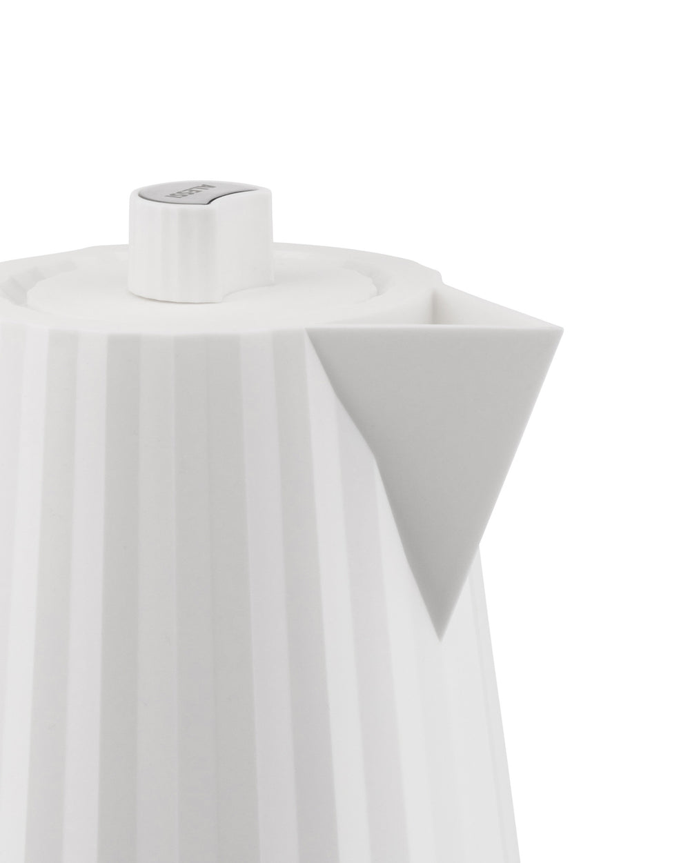 White electric kettle by Alessi with a fluted body, geometric spout, and gray logo on the lid's push-button.