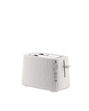 White toaster by Alessi with a pleated textured finish, control dial, and side lever.