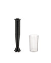 Black hand blender by Alessi with a ribbed design and a clear ribbed measuring cup on a white background.
