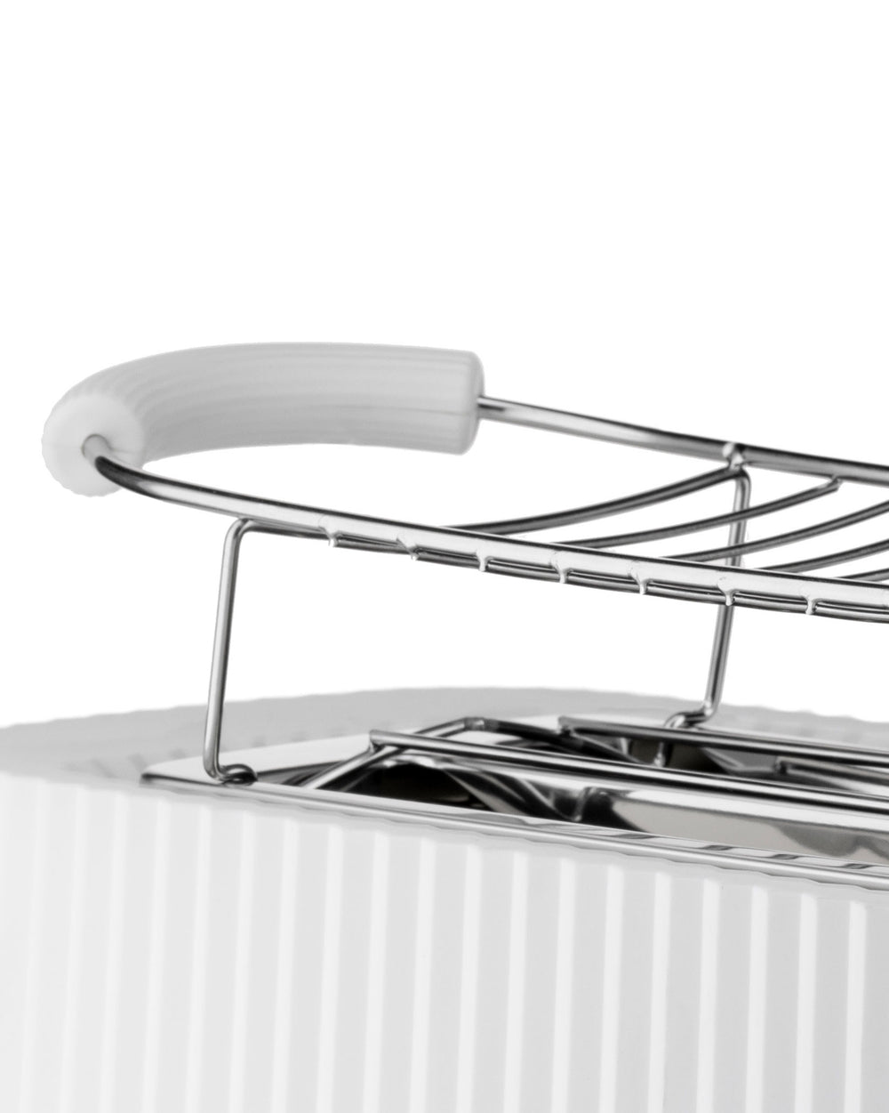 White ribbed toaster with chrome warming rack by Alessi, a close-up view.
