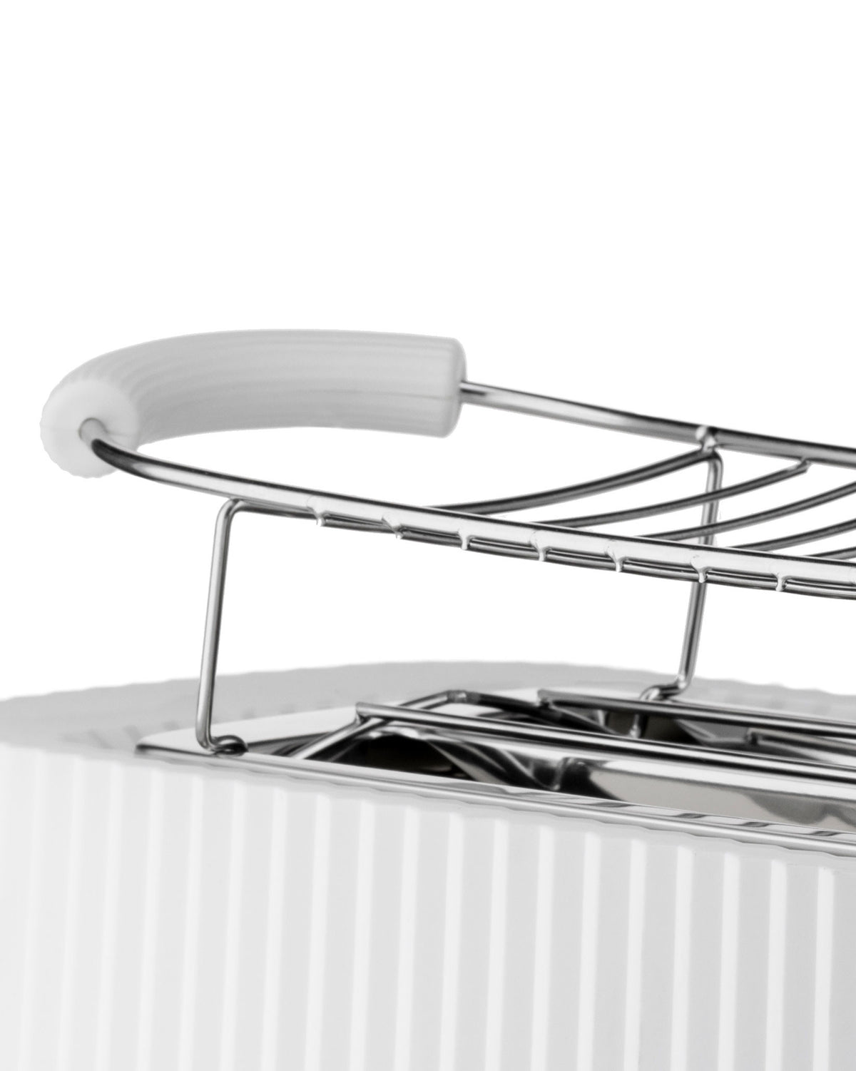 White ribbed toaster with chrome warming rack by Alessi, a close-up view.