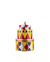 Colorful vertically stacked metal containers by Alessi, with red, yellow, black, and white geometric patterns, topped with a gold finial.