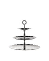 Three-tier silver metallic serving stand by Alessi with scalloped edges and engraved swirling patterns.