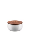 White ceramic bowl with a wooden lid by Alessi, featuring an engraved floral and leaf pattern and 'Ahhh' text.