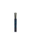 Lily home fragrance diffuser refill by Alessi in a dark blue and purple patterned cylindrical holder with black diffuser reeds.