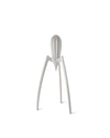 Silver-colored iconic juicer by Alessi, featuring a distinctive three-legged, spider-like design.
