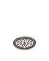 Silver metal French press filter by Alessi, featuring a perforated disk, mesh, and coiled spring edge.