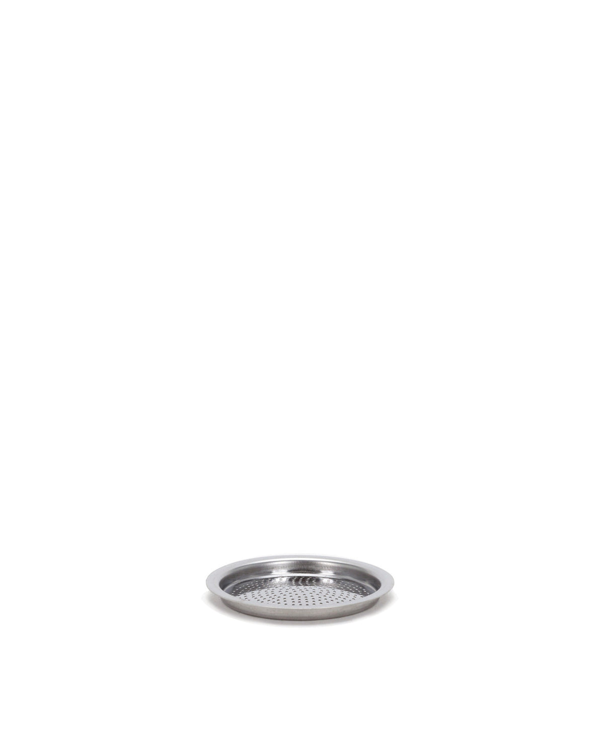 Perforated silver metal spare part by Alessi, with a raised rim and small holes, angled view.