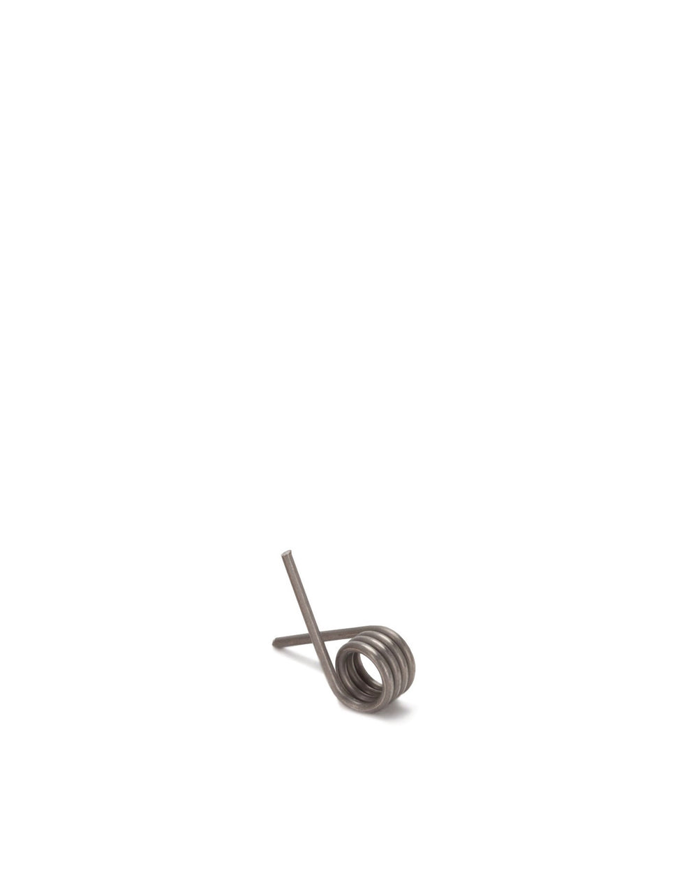 Grey metallic torsion spring by Alessi, featuring several tight coils and two straight ends, angled.