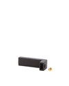 Black L-shaped plastic spare part by Alessi, with a side hole and a separate brass screw.