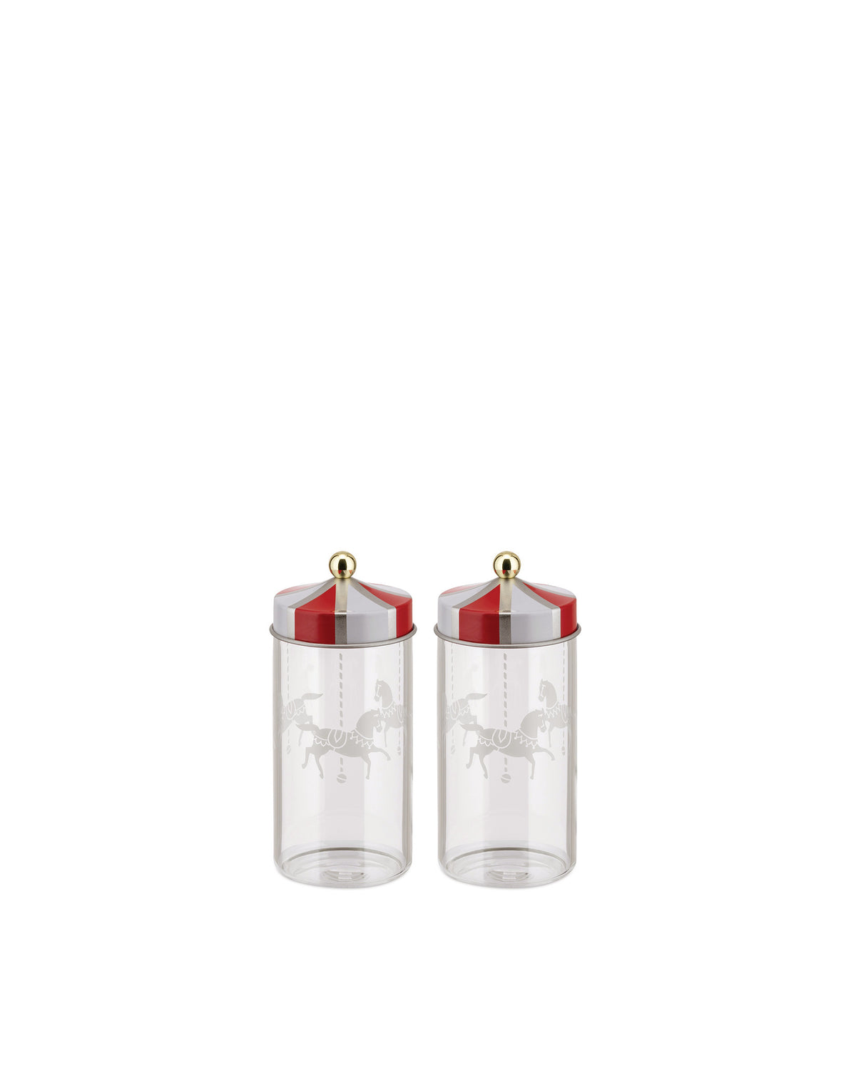 Two clear glass jars with red and white striped lids by Alessi, featuring a gold knob and carousel horse etching.