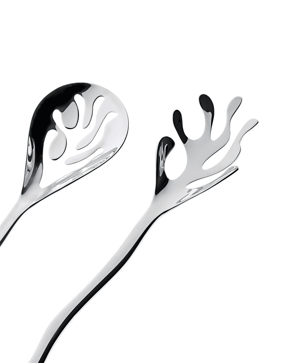 Mediterraneo serving plates by Alessi, featuring a shiny, sculptural slotted spoon and matching fork with flowing, abstract cutouts.