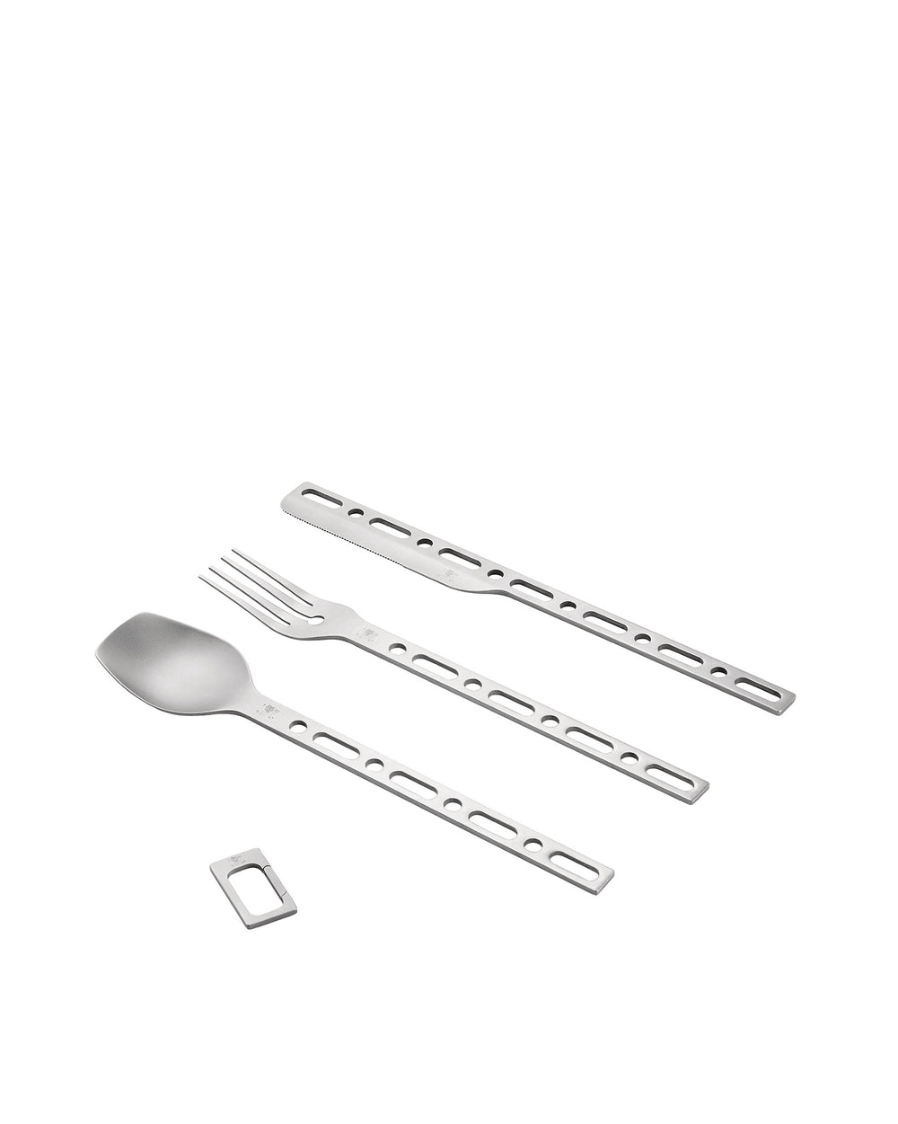 Metallic portable cutlery set by Alessi, featuring perforated handles and a small matching carabiner clip, on a white background.