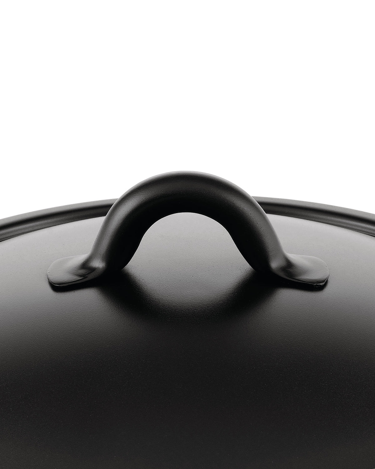Black matte pot lid by Alessi with a curved handle and slightly textured surface, seen from a top-down view.