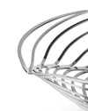 Silver polished metallic fruit bowl by Alessi, featuring an intricate, interwoven skeletal design, cropped.